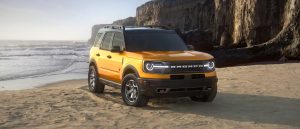 2021 Ford Bronco in Cyber Orange at a beach